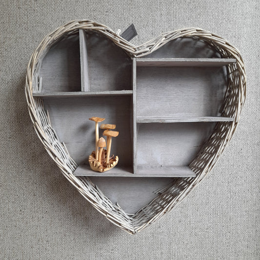 Heart-shaped wicker display shelf